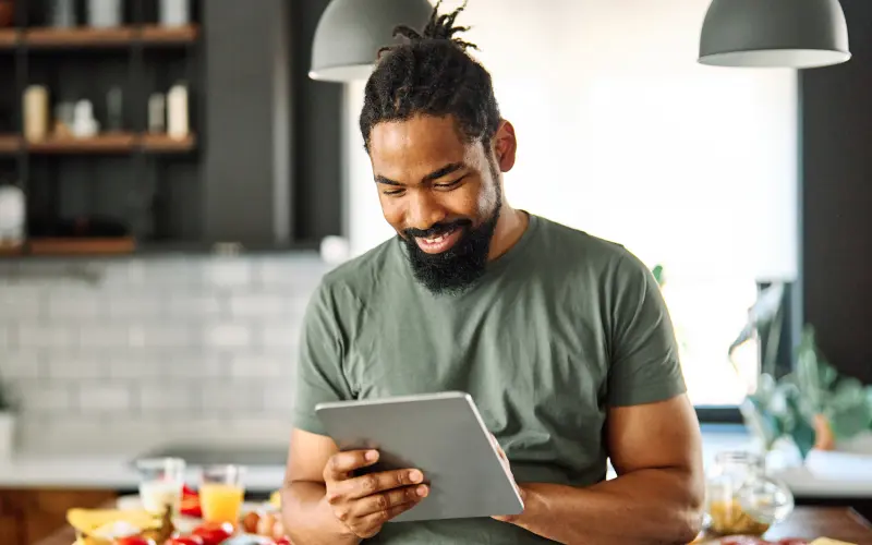 man looking at tablet