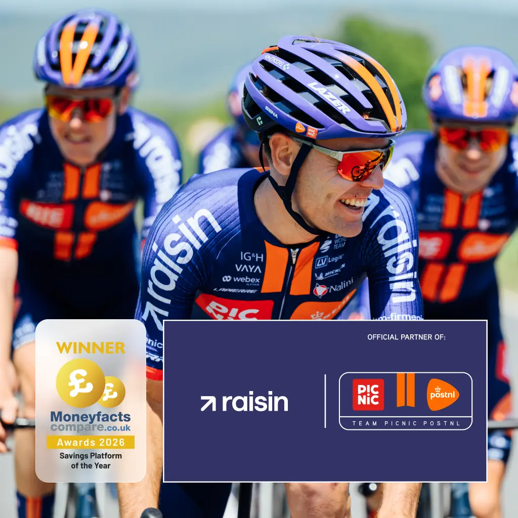 A cyclist in full Picnic PostNL kit, with the Raisin logo visible on his sleeves.