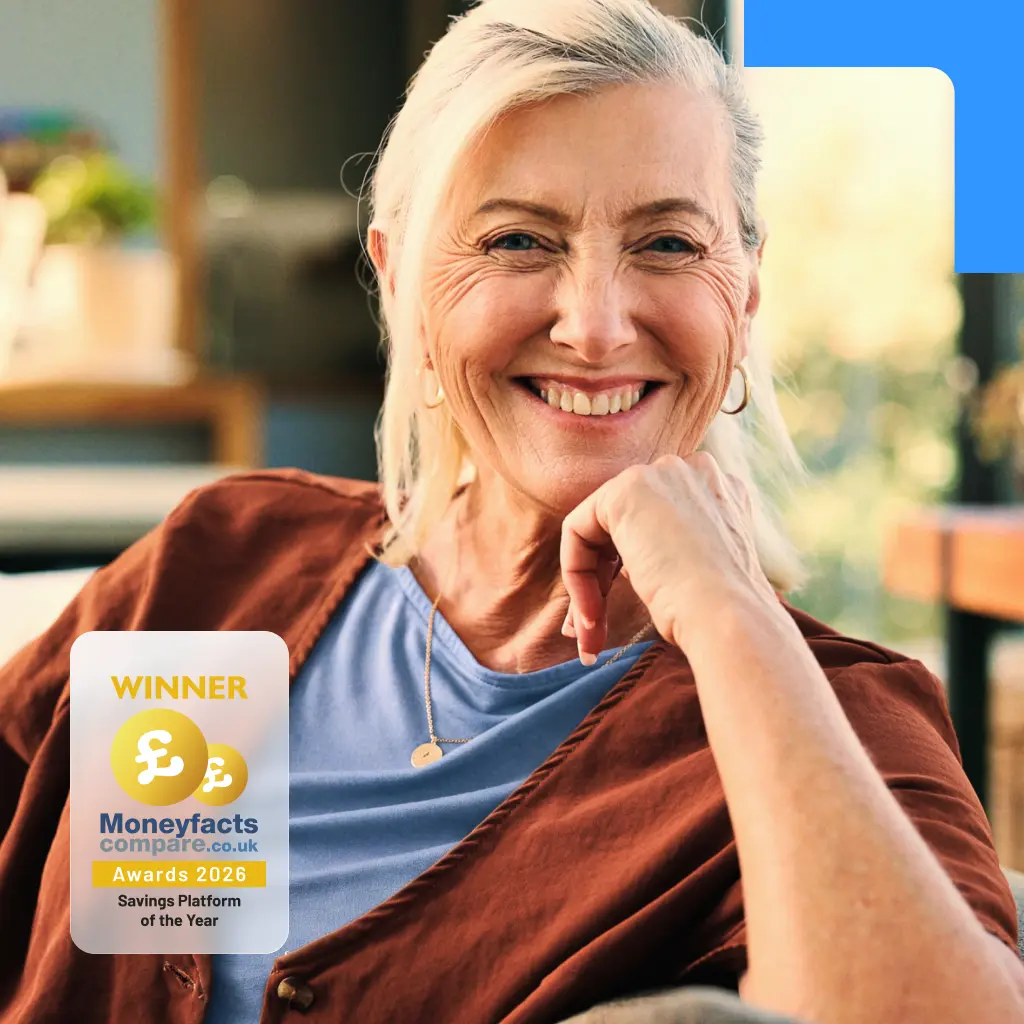A smiling mature woman with grey hair resting her chin on her hand, featuring a Moneyfacts Awards 2026 badge overlay in the corner.