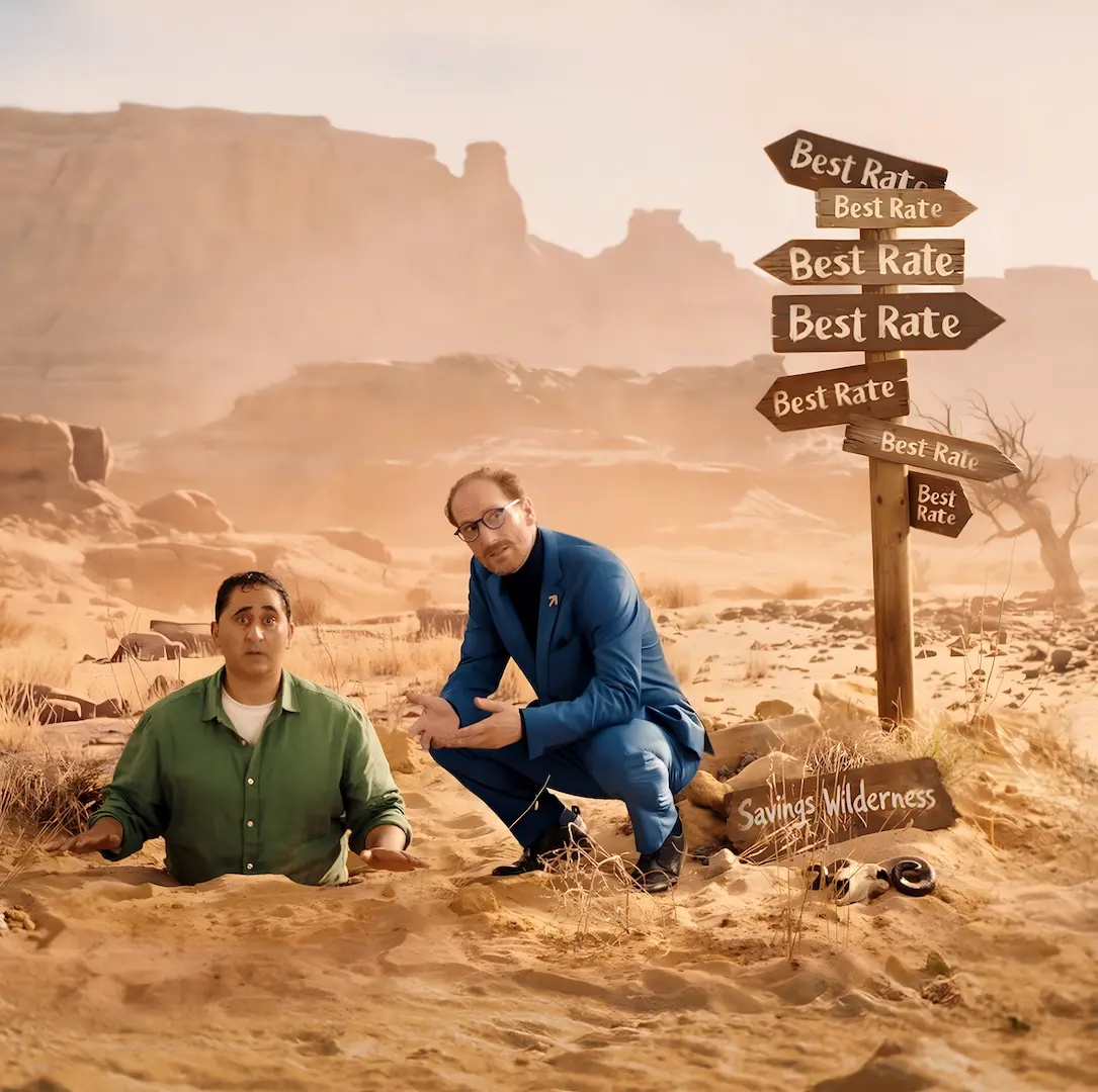 A man trapped in desert quicksand sits next to a suited man beside a signpost with conflicting "Best Rate" arrows.