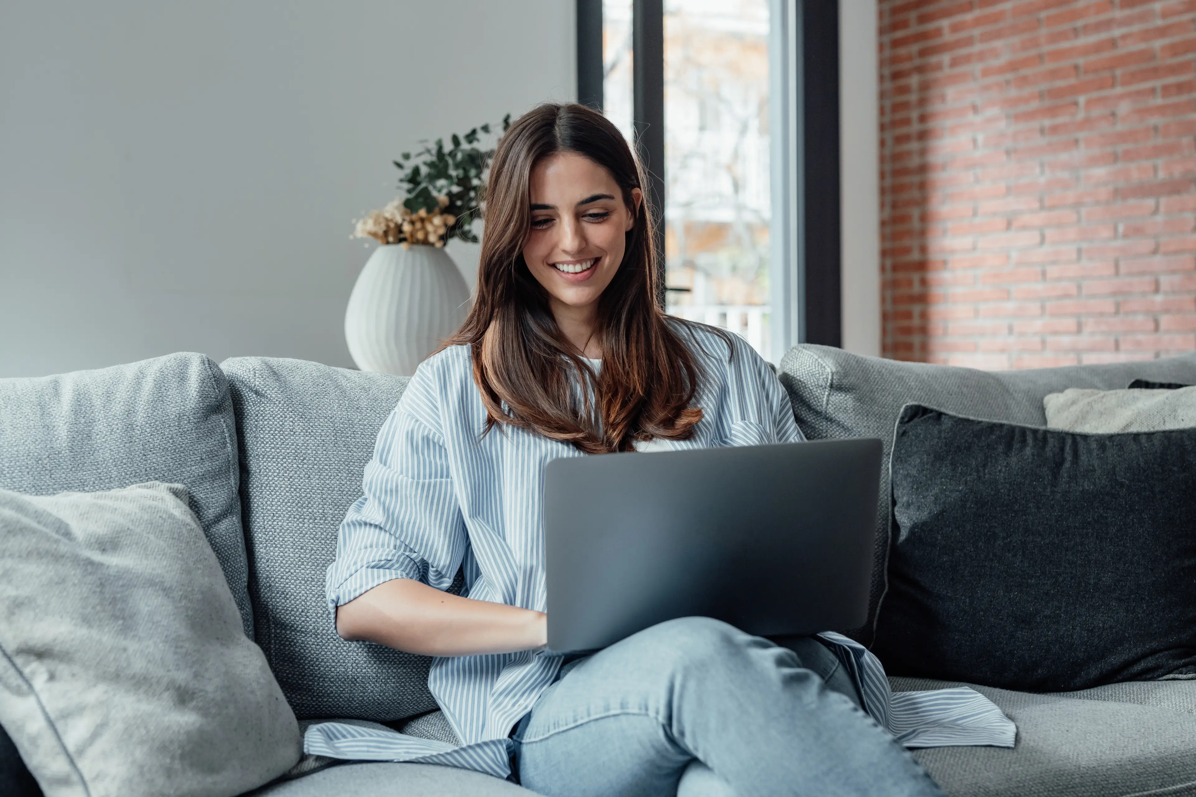 A woman sitting and smiling