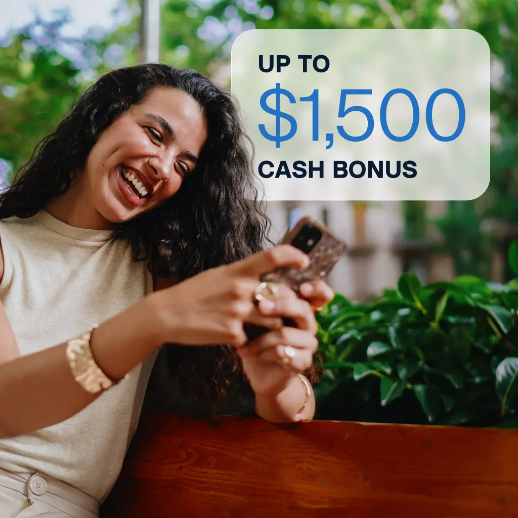 Woman looking at phone and smiling