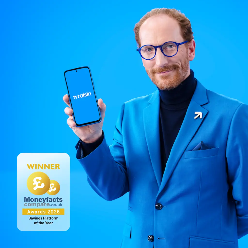 Close-up of Raisin spokesperson presenting a smartphone displaying the blue Raisin app logo.