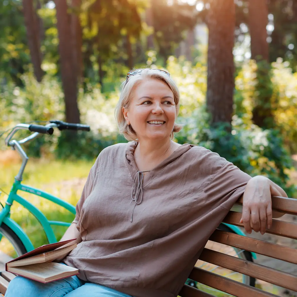 northpointe-bank-about-1024.png woman sitting on bench